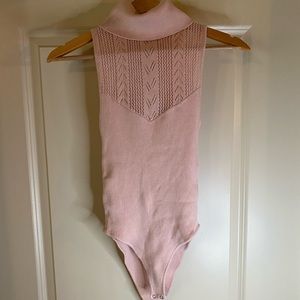 Light pink turtleneck body suit